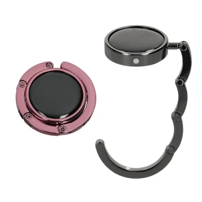 Abbildung von kwmobile Taschenhalter für Tisch 2X Faltbare Antirutsch Handtaschenhalter Haken Taschen Aufhänger Geschenkidee Gadgets Frauen Taschenhaken Set in Schwarz Hellrosa