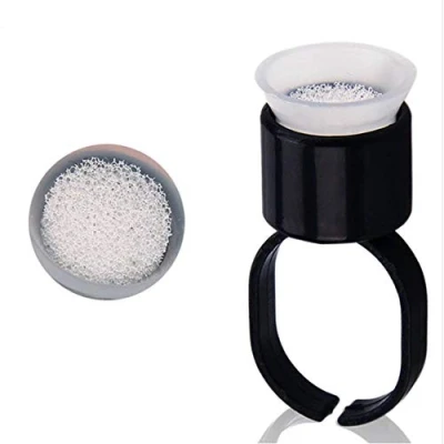 Abbildung von 50 Stück Tattoo Ink Cup Ring mit Schwamm Makeup Pigment Cups für Microblading Wimpern Kleber Becherhalter Schwarz