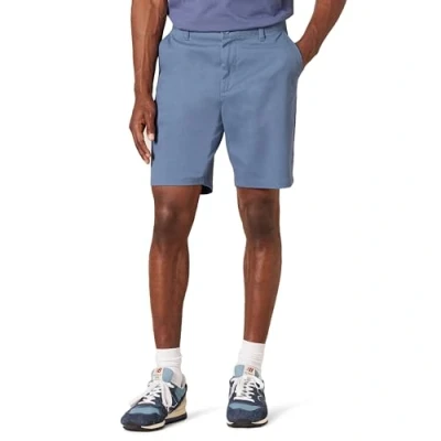 Abbildung von Amazon Essentials Herren 23 cm Lange Stretch Chinohose mit schmaler Passform, Dunkelblau, 42W