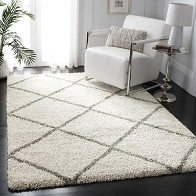 Abbildung von SAFAVIEH Zottelig Teppich für Wohnzimmer, Esszimmer, Schlafzimmer Hudson Shag Collection, Hoher Flor, Elfenbein und Grau, 155 X 229 cm
