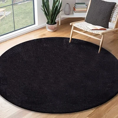 Abbildung von the carpet Relax Moderner Flauschiger Kurzflor Teppich, Anti Rutsch Unterseite, Waschbar bis 30 Grad, Super Soft, Felloptik, Schwarz, 120 x cm Rund