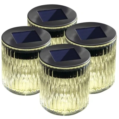 Abbildung von Lunartec Solar Windlicht Glas: 4er Set LED aus Echtglas mit tollem Lichtmuster, IP44 (Schattenlaterne, Motiv Leuchte, Tischleuchte)