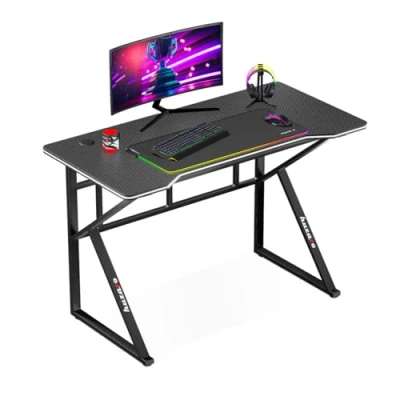 Abbildung von Huzaro Hero 1.6 Black Computertisch Gamingtisch Schreibtisch Bürotisch PC Tisch 120 x 60 cm Zwei Kabeldurchführung Gaming Homeoffice Stahlkonstruktion Carbon Tischplatte Schwarz
