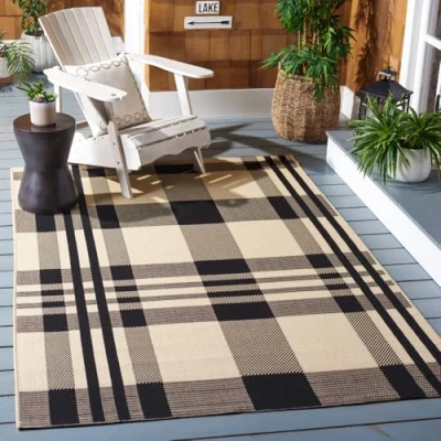Abbildung von SAFAVIEH Zeitgenössische Teppich für Wohnzimmer, Esszimmer, Schlafzimmer Courtyard Collection, Kurzer Flor, Schwarz und Knochen, 122 X 170 cm