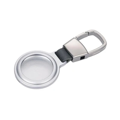 Abbildung von TROIKA Schlüsselanhänger/Schutzhülle für APPLE AirTag® AIRTAG HOLDER mit Karabiner flexible Befestigung Aussparung Magnetverschluss Aluminium silberfarben Original