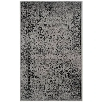 Abbildung von SAFAVIEH Distressed Teppich für Wohnzimmer, Esszimmer, Schlafzimmer Adirondack Collection, Kurzer Flor, Grau und Schwarz, 91 X 152 cm