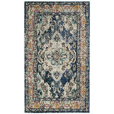 Abbildung von SAFAVIEH Boho Teppich für Wohnzimmer, Esszimmer, Schlafzimmer Monaco Collection, Kurzer Flor, Marineblau und Hellblau, 91 X 152 cm