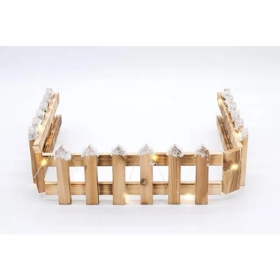 Abbildung von Spetebo Holz Dekozaun mit 15 LED in warm weiß 90 x 10 cm Mini Gartenzaun Kunstschnee Tischdeko Winter Gatter Weihnachtsdeko beleuchtet Batterie betrieben Timer