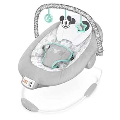 Abbildung von Bright Starts, Disney Baby, Micky Maus Babywippe mit beruhigenden Vibrationen, Melodien, abnehmbarem Spielbogen, 3 Hängespielzeugen und mehr