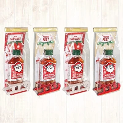 Abbildung von 4er Set Weihnachtsliköre: Weihnachtsüberraschung Kräuterlikör mit Schlitten und lustigen Sprüchen Liköre zu Weihnachten in schöner Geschenkverpackung