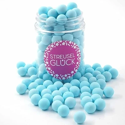 Abbildung von Streusel GLÜCK Tortendeko Schokokugeln hellblau pastell 90g Zuckerstreusel Geburtstag Junge Kuchendeko Weihnachten Schokoperlen Sprinkles Deko Torte Kuchen Cupcakes essbare Streudeko