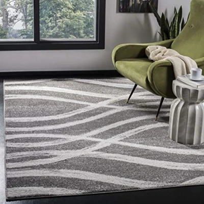 Abbildung von SAFAVIEH Distressed Teppich für Wohnzimmer, Esszimmer, Schlafzimmer Adirondack Collection, Kurzer Flor, Kohle und Elfenbein, 155 X 229 cm