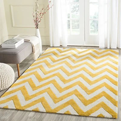 Abbildung von SAFAVIEH Modern Teppich für Wohnzimmer, Esszimmer, Schlafzimmer Cambridge Collection, Kurzer Flor, Gold und Elfenbein, 152 X 244 cm