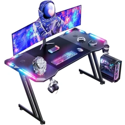 Abbildung von HLONONE 120 x 60 cm Gaming Tisch, Schreibtisch mit LED, PC Tisch Kohlefaseroberfläche, Stabiler Computertisch für Kopfhörerhaken und Getränkehalter, Schwarz
