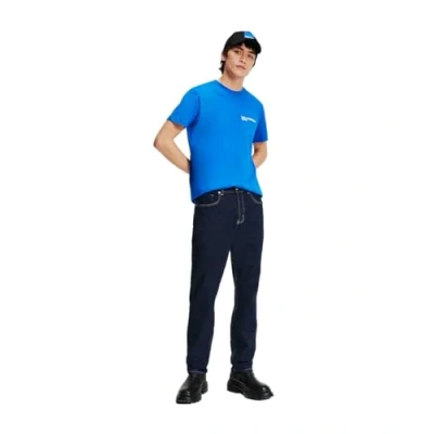Abbildung von KARL LAGERFELD JEANS Men&#039;s Tapered Denim Jeans, Rinse Blue, 32W x 34L