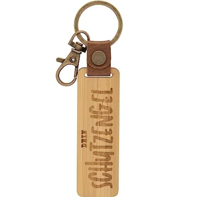 Abbildung von GRUSS &amp; CO Schlüsselanhänger Holz Motiv Engel Anhänger aus Bambus mit Gravur Dein Schutzengel, inkl. Karabiner 48339