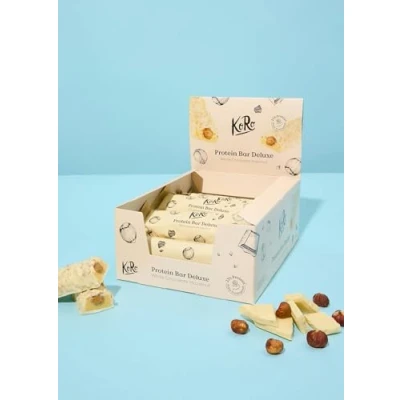 Abbildung von KoRo Protein Bar Deluxe White Chocolate Hazelnut 12 x 55 g Proteinreich (23 g/100 g) Nussige Füllung &amp; schokoladiger Mantel Ohne Zuckerzusatz, enthält Süßungsmittel*