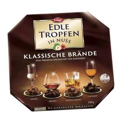 Abbildung von Edle Tropfen in Nuss Klassische Brände 250g, flüssig gefüllte Schokoladenpralinen mit Milchschokoladen Überzug und knackigen Haselnuss Splittern