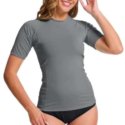 Abbildung von MEETWEE Damen Surf Rash Guard Sonnenschutz Badeanzug UV Schutz Shirt UPF 50+ Kurzarm Badeoberteil Schnell trocknendes Schwimm Sonnenschutzshirt für Wassersport.