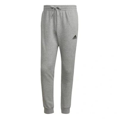 Abbildung von adidas Herren Essentials Fleece Regular Tapered Pants, Medium Grey Heather / Black, XL Short