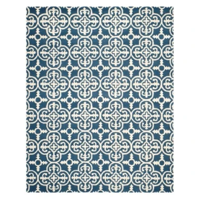 Abbildung von SAFAVIEH Traditionell Teppich für Wohnzimmer, Esszimmer, Schlafzimmer Cambridge Collection, Kurzer Flor, Marine und Elfenbein, 91 X 152 cm