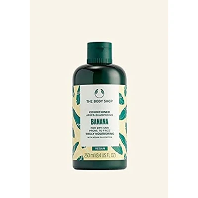 Abbildung von The Body Shop Banana Truly Nourishing Conditioner für trockenes Haar, das zu Frizz neigt, beschädigt, vegan, 250 ml