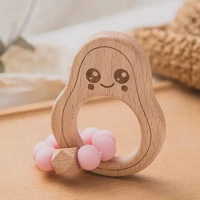 Abbildung von Avocado Beißring für Baby Natur Holz pink Kauspielzeug &amp; Zahnungshilfe Jungen Mädchen Babyspielzeug Beissring Geschenk zur Geburt Holzspielzeug nachhaltig, BPA frei, schadstofffrei